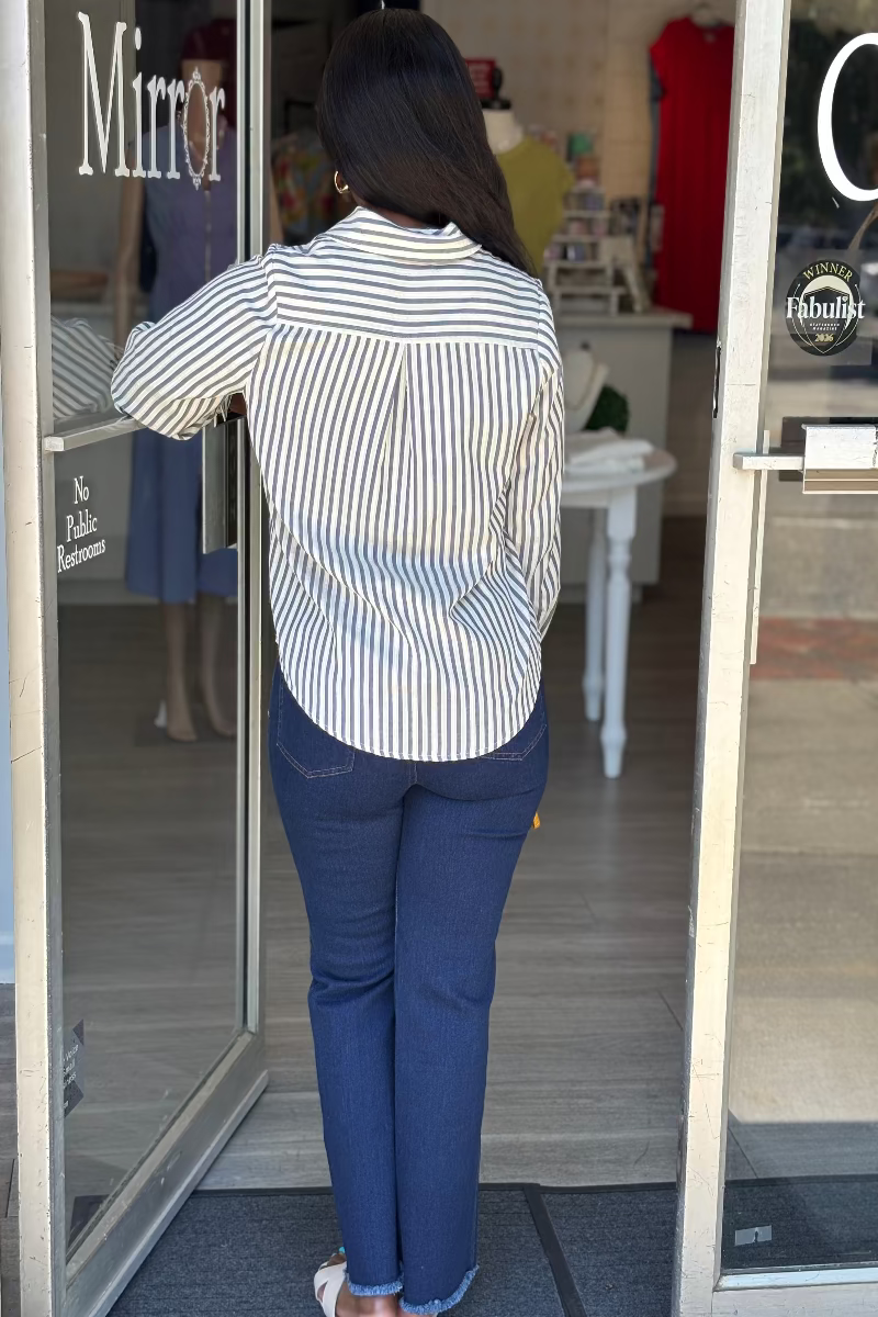 Dark denim and white striped long sleeve top with V-slit neckline, reinforced rectangular bib placket, single button detail, pointed collar, and buttoned cuffs — Mirror on Main