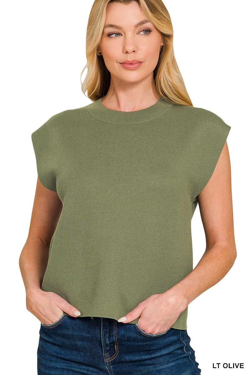 Woman wearing a light olive sleeveless viscose sweater vest with crew neckline and blue denim jeans – Mirror On Main