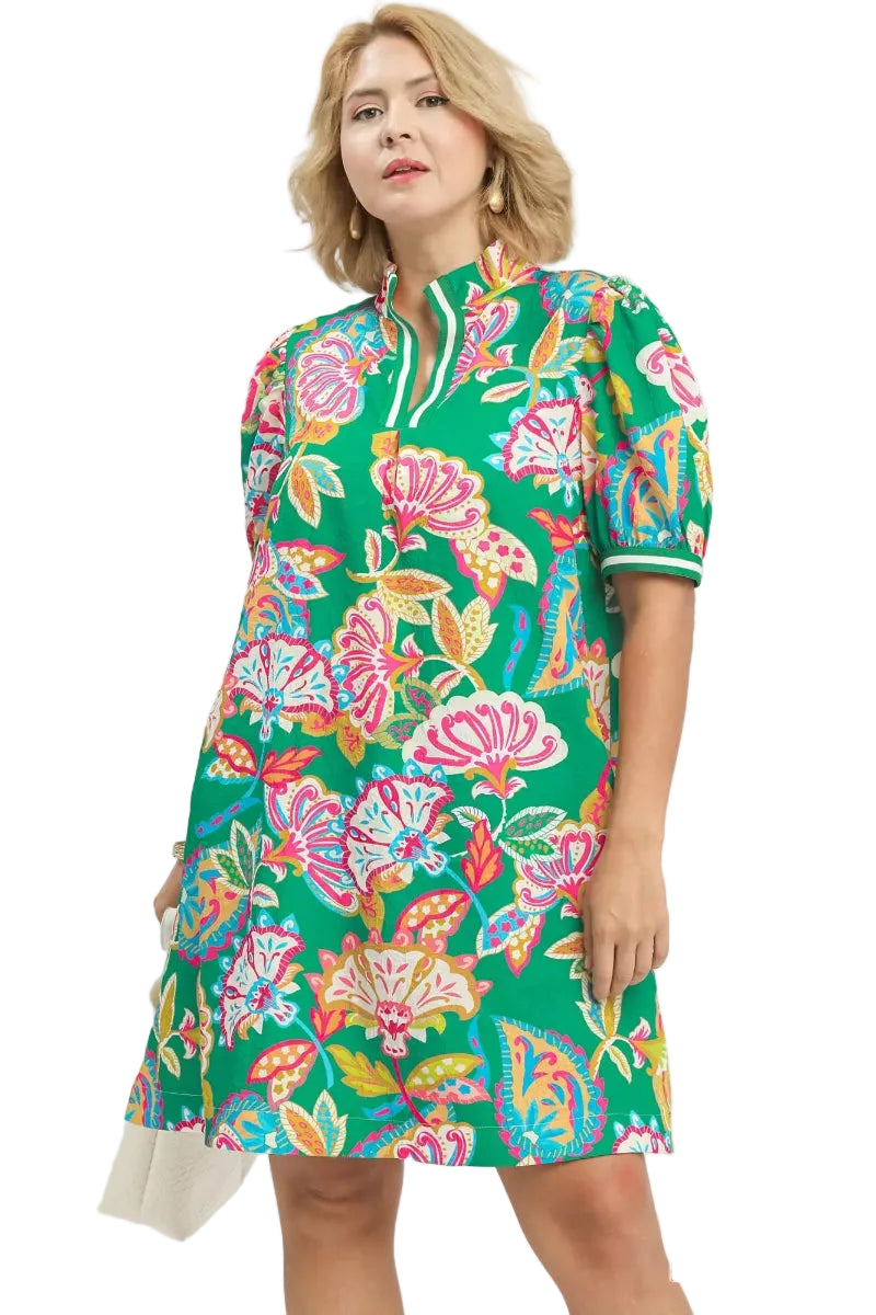 Plus size woman wearing an emerald green tropical floral puff-sleeve mini shift dress with split V-neckline and striped cuff detail — Mirror on Main