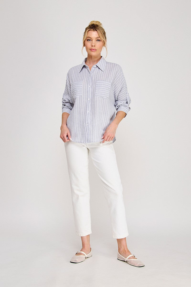 Blue and white pinstripe linen-blend button-down shirt with spread collar, roll-tab long sleeves, dual chest patch pockets, back pleat, and curved hem — Mirror on Main