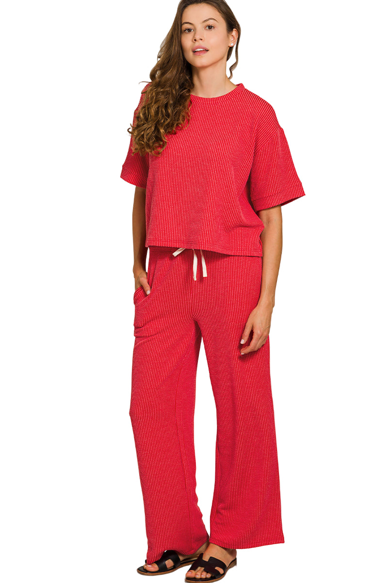 Woman wearing a red outfit on a white background