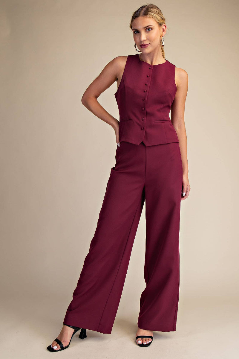 Woman wearing burgundy high waist wide leg pants with elastic waistband, styled with black heeled sandals — Mirror on Main