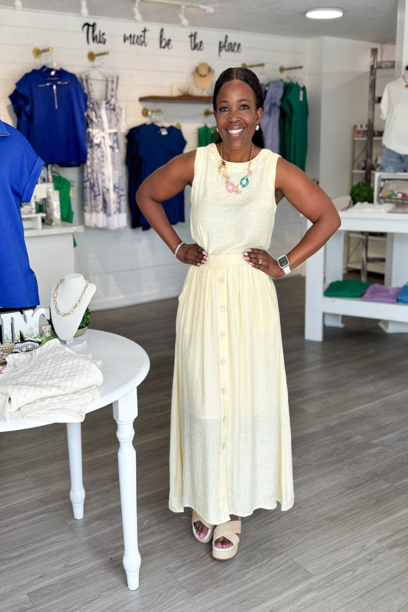 Butter Yellow Button Front Textured Midi Skirt with high waist, back elastic tunnel waistband, front button detail and fully lined midi length in soft butter yellow