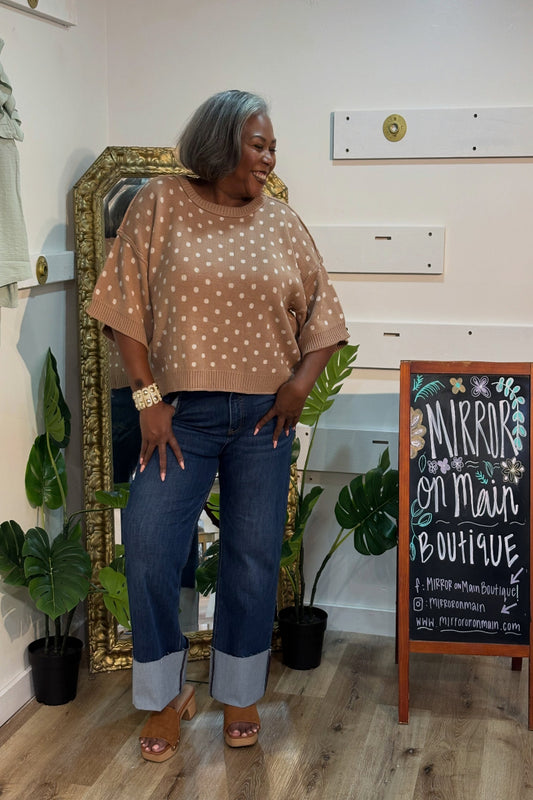 Woman wearing a camel and ivory polka dot short sleeve knit sweater top with round neckline and ribbed trim — Mirror on Main