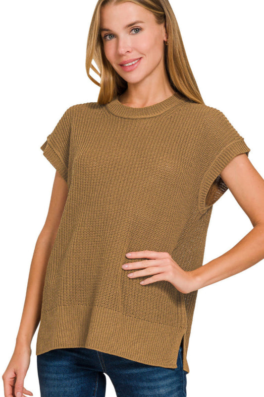 Woman wearing a deep camel sweater with short sleeves on a white background
