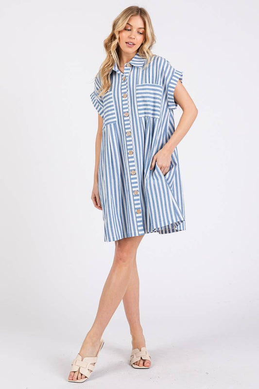 Woman wearing a blue and white striped dress on a white background