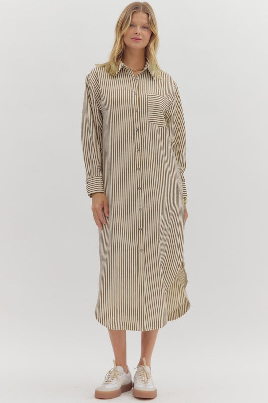 Woman wearing a striped shirt dress on a white background