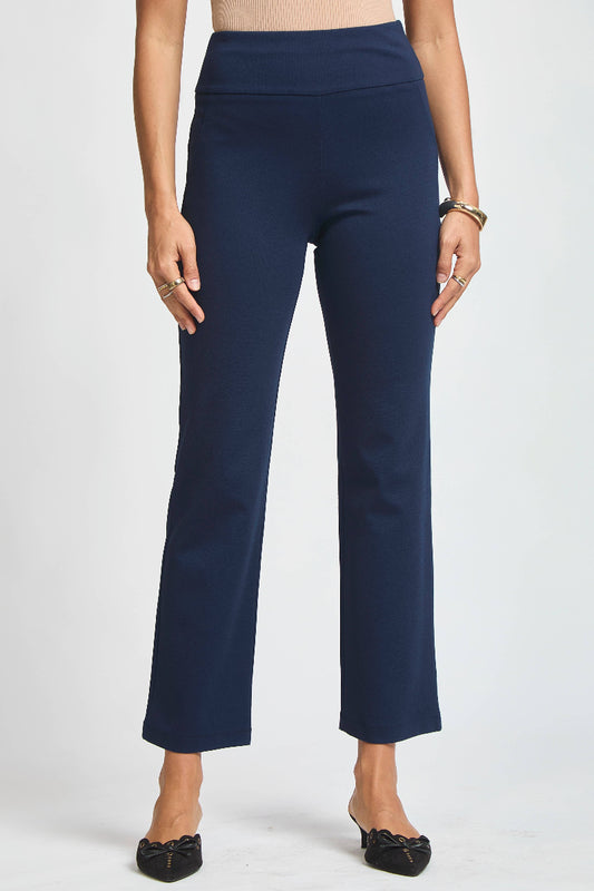 Navy blue pants worn by a person on a white background