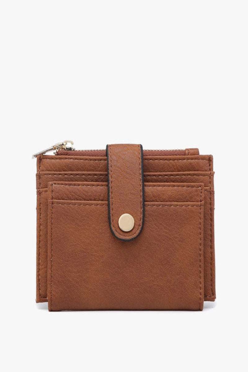 Brown leather wallet with a strap on a white background