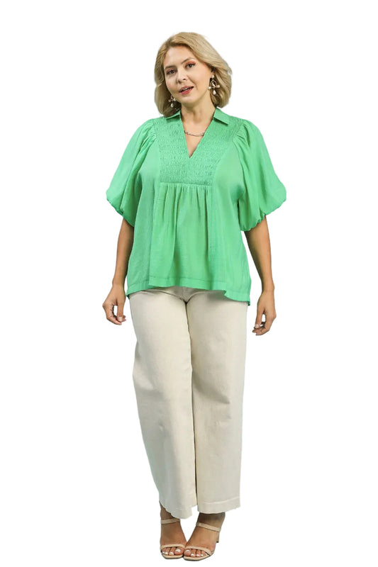 Plus size woman wearing a mint green bubble sleeve top with collared V-neck and smocked front yoke — Mirror on Main