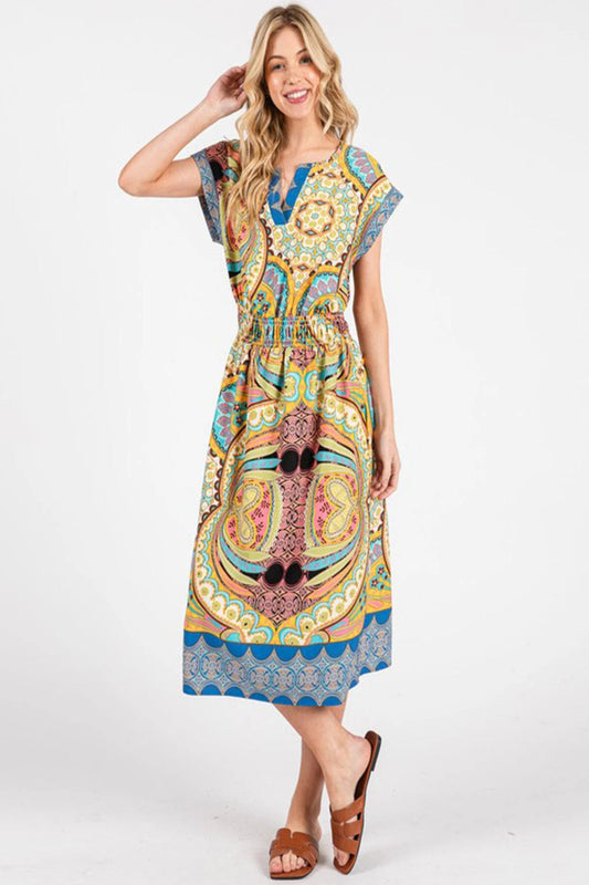 Woman wearing a colorful patterned dress on a white background