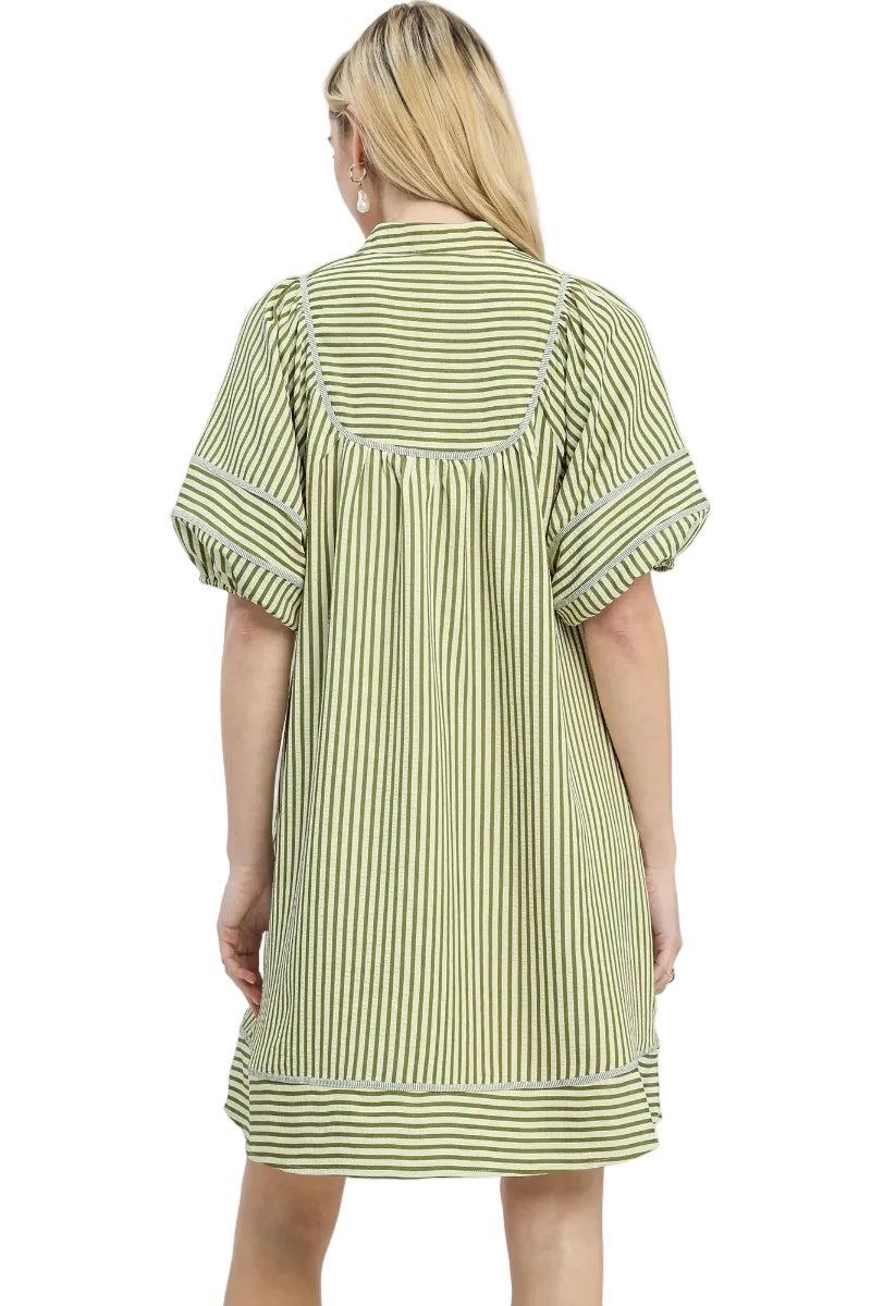 Light olive and cream vertical stripe babydoll mini dress with contrast horizontal border hem, split V-neckline, short puff sleeves with cuffed hem, and side pockets — Mirror on Main