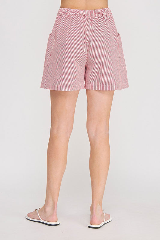 Red and white pinstripe cotton-linen twill shorts with contrast red drawstring tie, elastic waistband, and front and back patch pockets — Mirror on Main