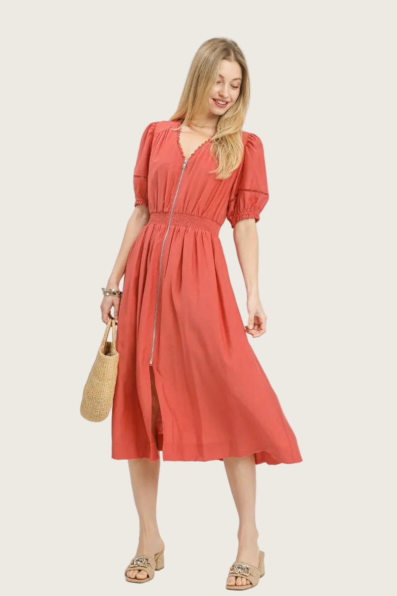 Salmon rayon midi dress with lace-trimmed V-neckline, full-length exposed front zipper, short puff sleeves with elastic cuffs and ladder lace trim, smocked waistband, and full A-line skirt with side pockets — Mirror on Main
