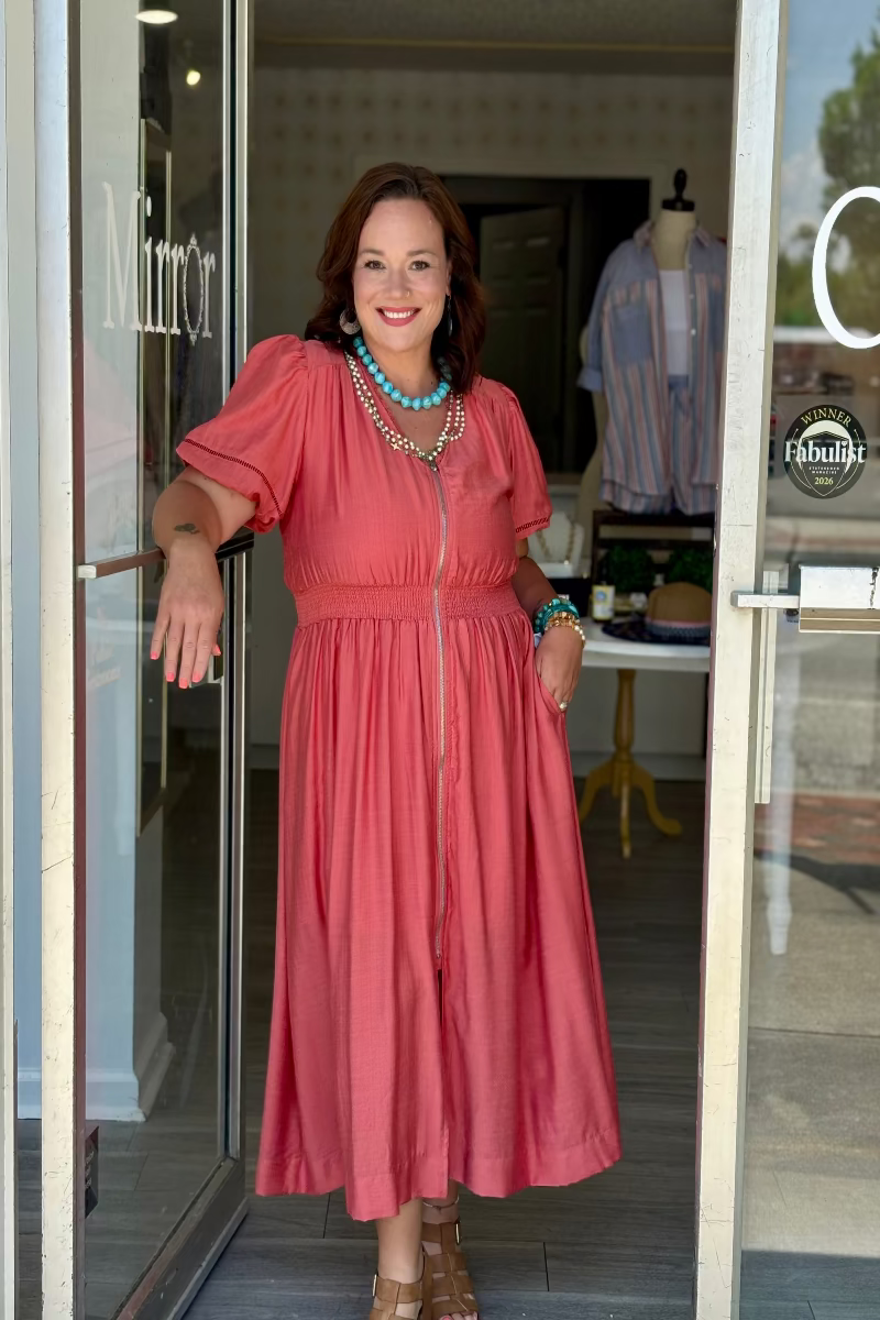 Salmon rayon midi dress with lace-trimmed V-neckline, full-length exposed front zipper, short puff sleeves with elastic cuffs and ladder lace trim, smocked waistband, and full A-line skirt with side pockets — Mirror on Main