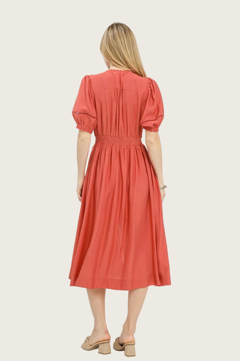 Salmon rayon midi dress with lace-trimmed V-neckline, full-length exposed front zipper, short puff sleeves with elastic cuffs and ladder lace trim, smocked waistband, and full A-line skirt with side pockets — Mirror on Main