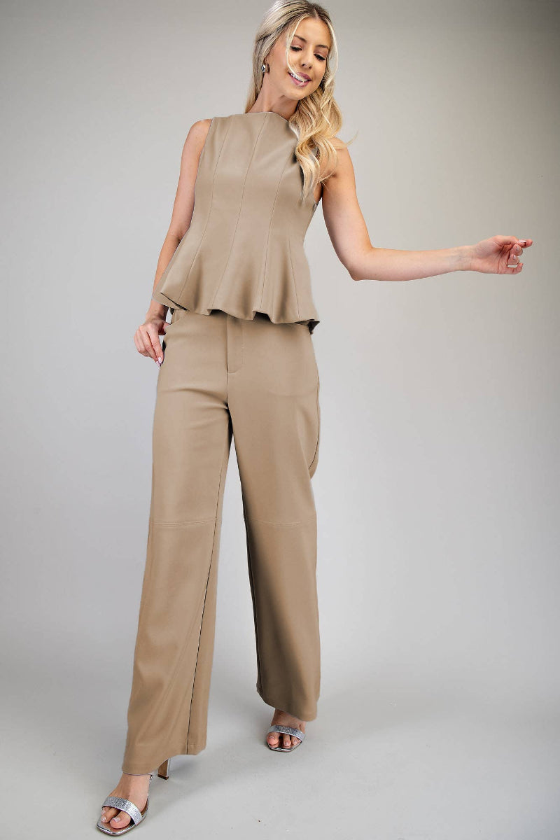 Woman wearing taupe straight leg pants with front pockets and paneling detail, styled with silver strappy heels — Mirror on Main