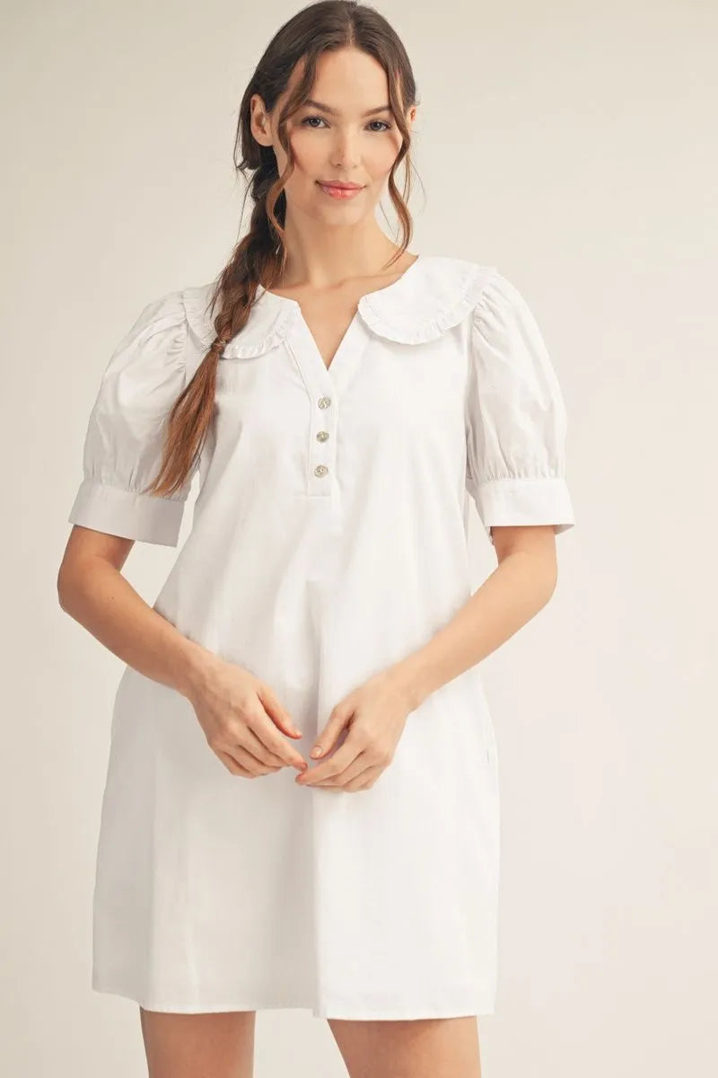 white cotton shift dress with puff sleeves and ruffled Peter Pan collar