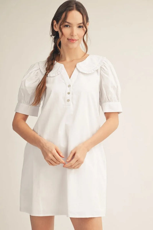 white cotton shift dress with puff sleeves and ruffled Peter Pan collar