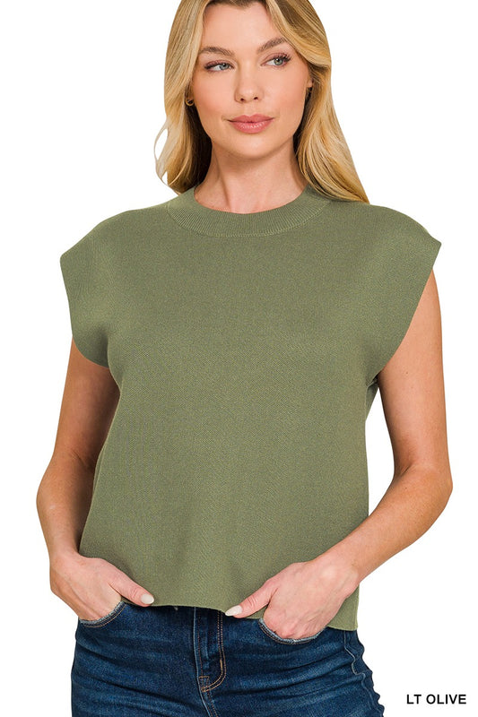 Woman wearing a light olive sleeveless viscose sweater vest with crew neckline and blue denim jeans – Mirror On Main