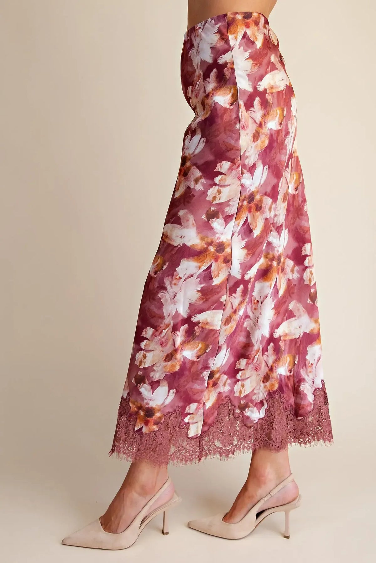Mauve floral satin midi skirt with high waist, cream and peach floral print, and delicate lace trim along the bottom hem, side view – Mirror On Main