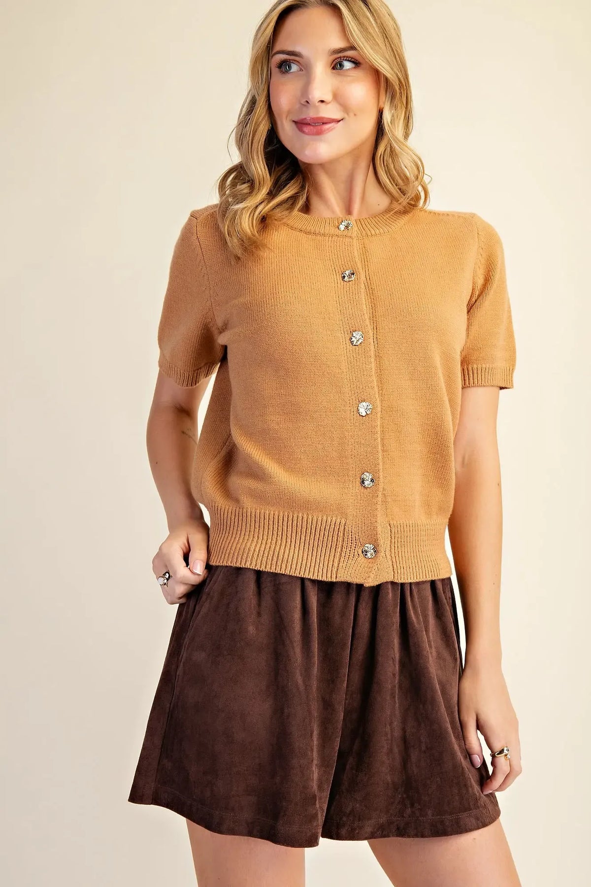 Camel short sleeve knit cardigan with round neckline, gold-tone floral buttons, ribbed cuffs and hem, modeled front view – Mirror On Main