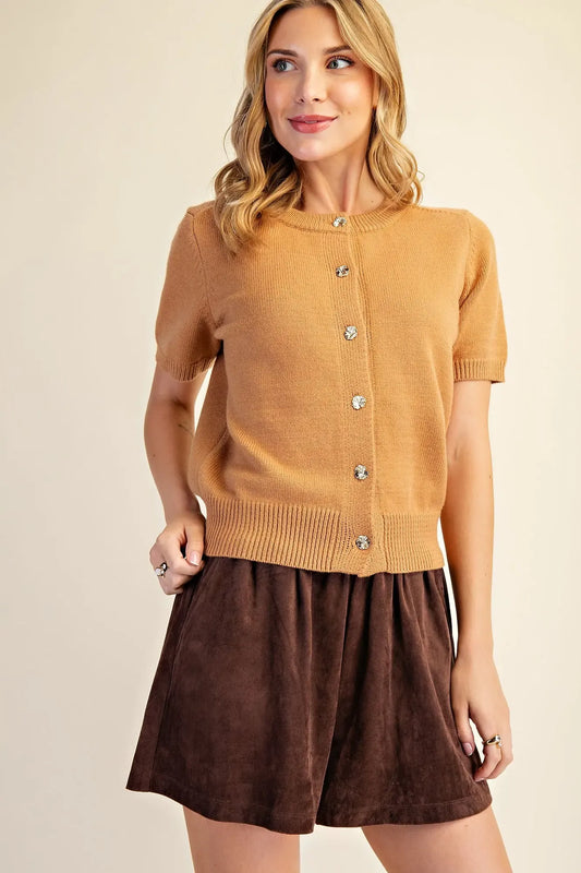 Camel short sleeve knit cardigan with round neckline, gold-tone floral buttons, ribbed cuffs and hem, modeled front view – Mirror On Main